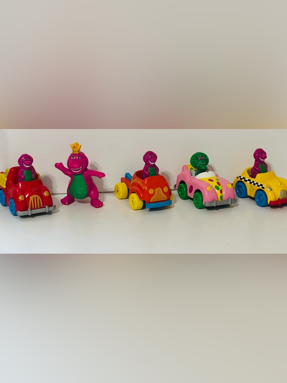 Barneys New York Red Toy Car with Purple Character and Yellow Wheels